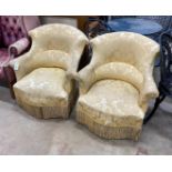 A pair of late Victorian upholstered tub framed armchairs