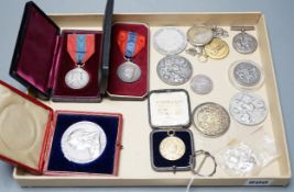 A group of silver commemorative medals, a Victoria 1889 crown, 1880 halfcrown, two cased ISM and
