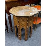 A Moorish octagonal mother of pearl inlaid table width 48cm, height 62cm.