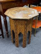 A Moorish octagonal mother of pearl inlaid table width 48cm, height 62cm.