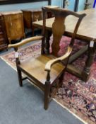A George III Provincial oak and elm wood seat elbow chair, width 64cm, depth 56cm, height 106cm