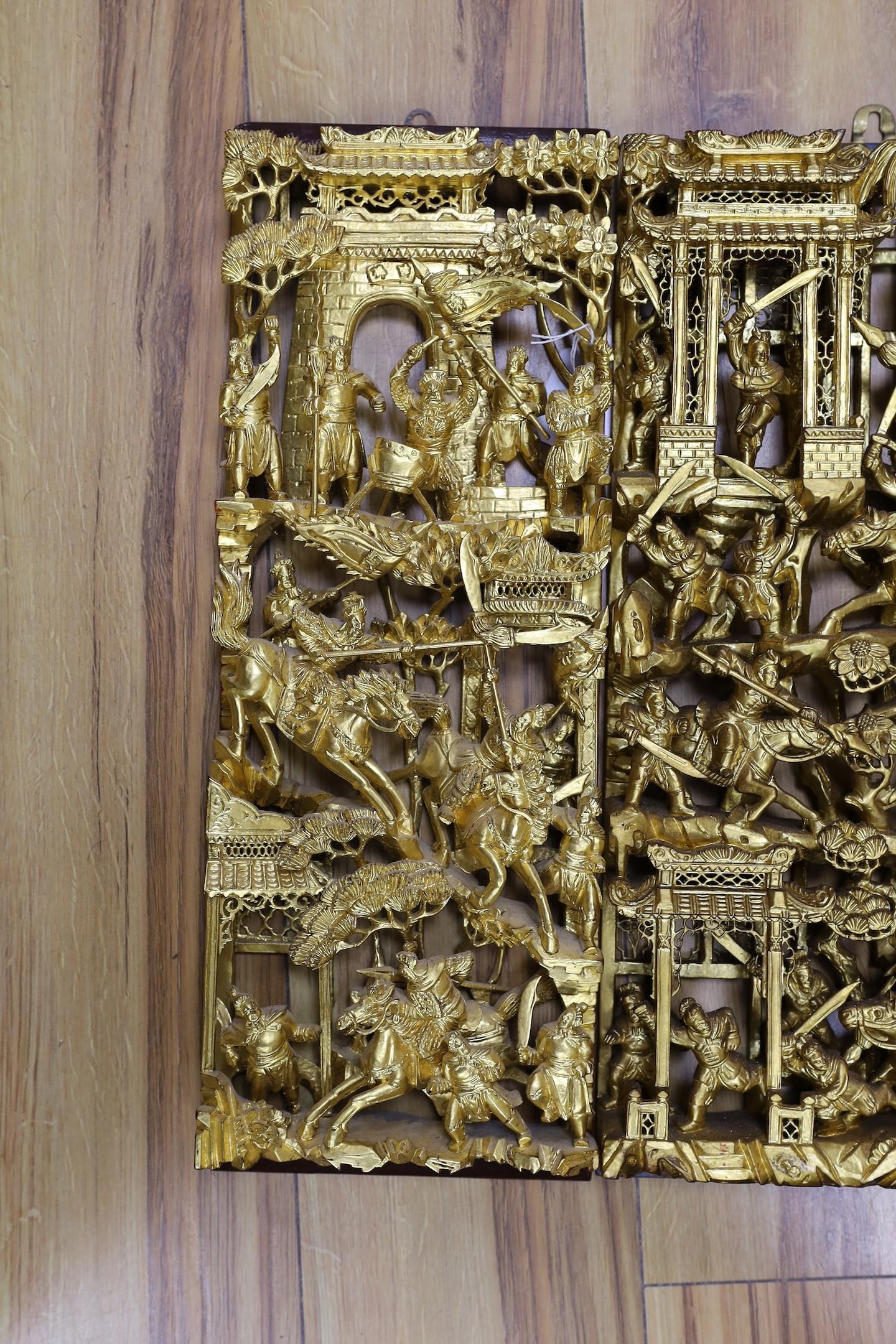 Three Chinese carved giltwood ‘warriors’ panels, largest 48 cm X 25 cm - Image 2 of 4