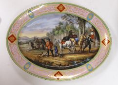 A large Vienna style porcelain oval dish, late 19th century, painted with huntsmen and horses in a