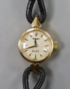 A lady's mid 20th century 750 yellow metal Rolex Orchid manual wind wrist watch, with engraved