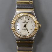 A lady's modern steel and yellow metal Omega Constellation quartz wrist watch and bracelet, with