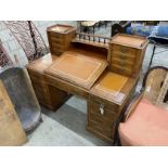 A late Victorian mahogany pedestal desk with hinged slant front, width 137cm, depth 73cm, height