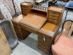 A late Victorian mahogany pedestal desk with hinged slant front, width 137cm, depth 73cm, height