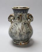 A Chinese Shiwan pottery ram's head handled hu vase. 17cm high