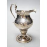 A George III silver inverted pear shaped cream jug, London, 1779, 31.1cm, maker's mark rubbed.