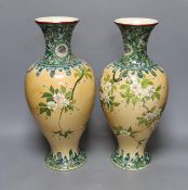A pair of Japanese Satsuma style cream ground moriage vases, 40cm