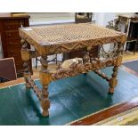 A Jacobean revival caned carved beech stool width 59cm, height 46cm.