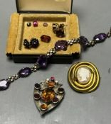 A white metal and gem set shield brooch, 49mm, a white metal and amethyst set necklace and other