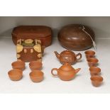 A Chinese Yixing pottery teapot, two boxes and covers and teawares