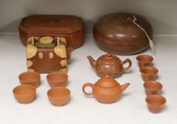 A Chinese Yixing pottery teapot, two boxes and covers and teawares