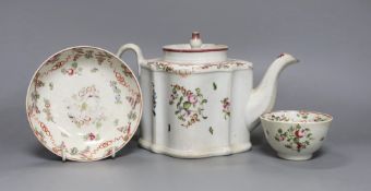 A New Hall type teapot and a similar tea bowl and saucer, teapot 15 cms high,