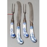 Two pairs of Bow blue and white pistol grip steel carving knives and forks, c.1755, longest night of