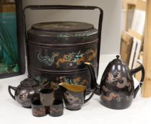 A Chinese Fuzhou lacquer ‘dragon’ wedding basket, 31cm high together with a similar teaset