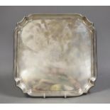A George V square silver salver, with inswept corners, William Hutton & Sons, Sheffield, 1926, 25.