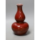 A Chinese sang de boeuf glazed double gourd vase, 18cm