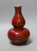 A Chinese sang de boeuf glazed double gourd vase, 18cm
