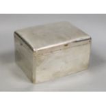 A George V silver mounted rectangular cigarette box, marks rubbed, maker's A & J Zimmerman, length