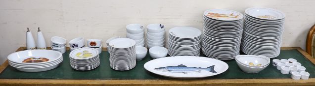 An extensive Richard Bramble for Jersey Pottery dinner service, decorated with fish, cheese etc.