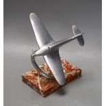 A mid 20th century aluminium model of a spitfire on ashtray marble base, spitfire 17cms wide