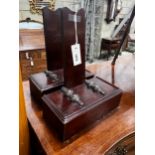 A pair of Gillow style mahogany plate stands, width 27cm, depth 13cm, height 34cm