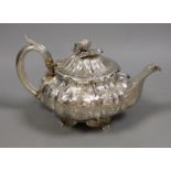 A William IV silver teapot, of squat melon form, WE, London, 1831, gross weight 23.3oz. Ivory