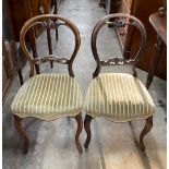 A set of four Victorian balloon back dining chairs