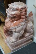 A Chinese carved marble dog of Fo, width 29cm, depth 45cm, height 78cm