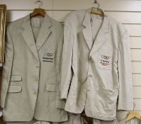 Four gentlemen’s cream suits and similar jacket, each bearing Berlin Olympics insignia