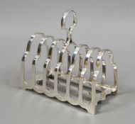 A George V silver seven bar toast rack, George Howson, Sheffield, 1926, length 13cm, 7.7oz.