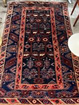 A Caucasian style blue ground rug, 200 x 128cm