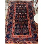 A Caucasian style blue ground rug, 200 x 128cm