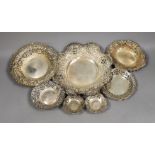 Seven assorted Victorian and later pierced silver nut or bonbon dishes, largest 22.6cm in