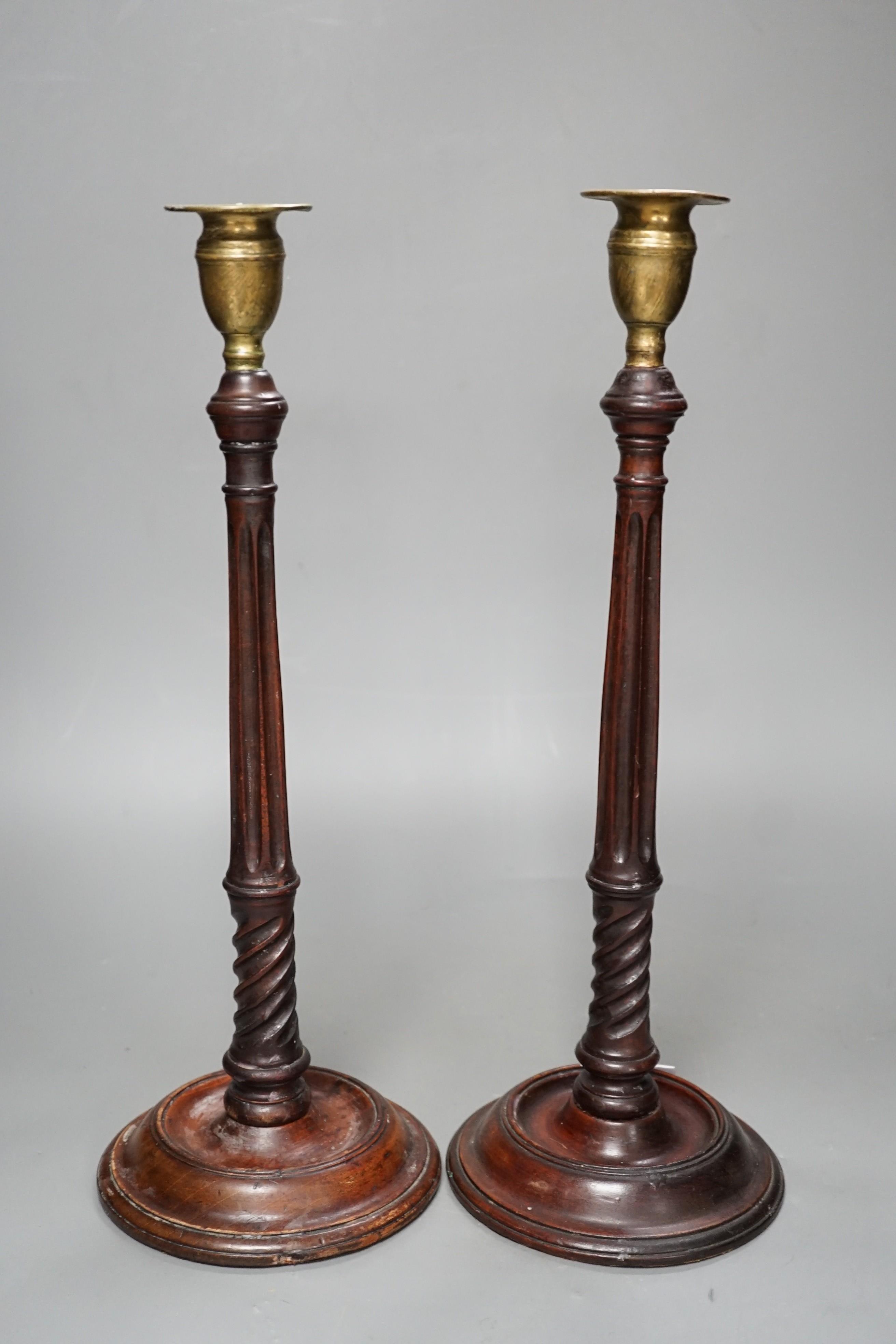 A pair of George III style carved mahogany candlesticks, with brass sconces, 38cms high - Image 3 of 6