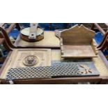 An Asian hardwood low seat, a relief carved panel, a lion's mask carved door and a cast iron grate