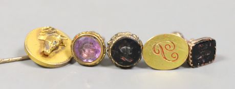 Three Victorian gilt metal fob seals, two set with bloodstone and carved with bust or bee, the other