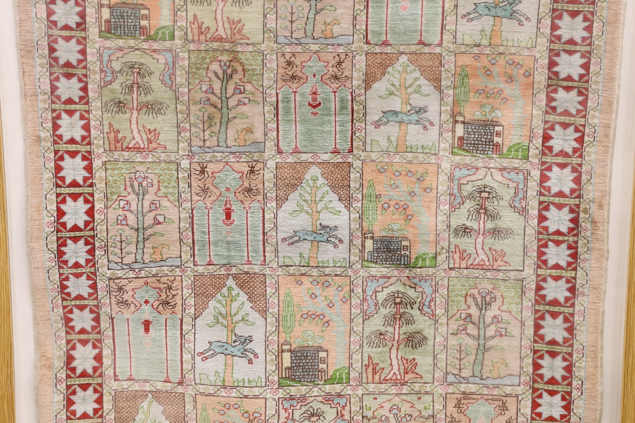 An Eastern framed silk rug depicting trees amimals and buildings, 86 cms high x 67cms wide - Image 3 of 4