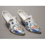 A pair of 19th century Delft polychrome models of shoes, 14cms wide