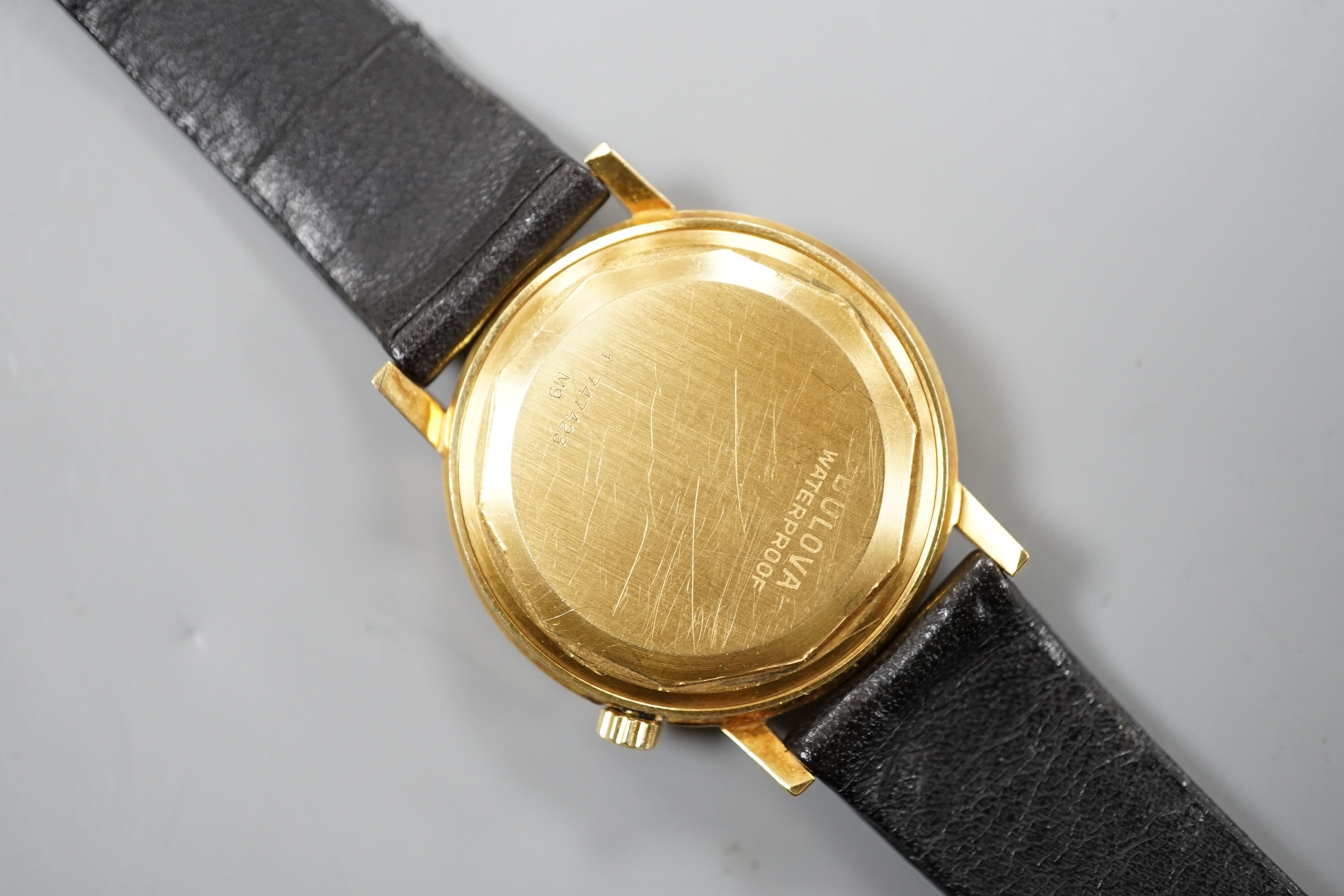 A gentleman's yellow metal Bulova Accutron wrist watch, on a black leather strap, case diameter - Image 3 of 3