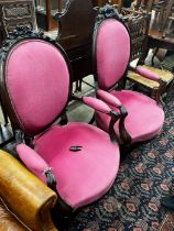 A near pair of 19th century French rosewood upholstered armchairs, larger width 61cm, depth 56cm,