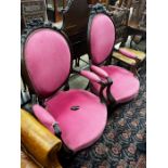 A near pair of 19th century French rosewood upholstered armchairs, larger width 61cm, depth 56cm,