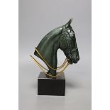 An Art Deco patinated bronze of a horses head on black marble base, 23cms high