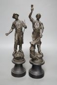 A pair of spelter blacksmith figures, tallest 34cms high