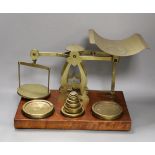 Victorian brass postal scales by S. Mordan & Co. of London, on a mahogany plinth, 45cm wide