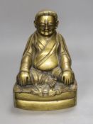 A Chinese bronze of a seated Marpa, 25cms high