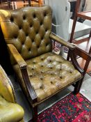 A George III style buttoned green leather library chair, width 64cm, depth 58cm, height 97cm