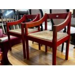 A set of four Magistretti Carimate chairs with rush seats
